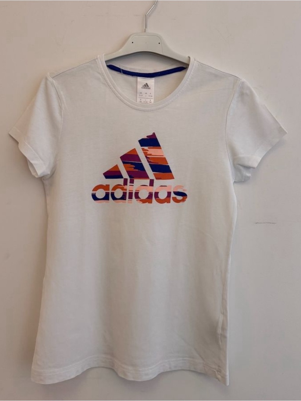adidas White Tee with Orange & Blue Striped Logo